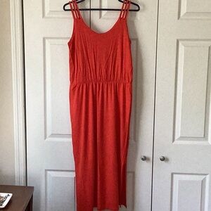 Lovely tomato-red sundress. Little braided straps, slit at the bottom.